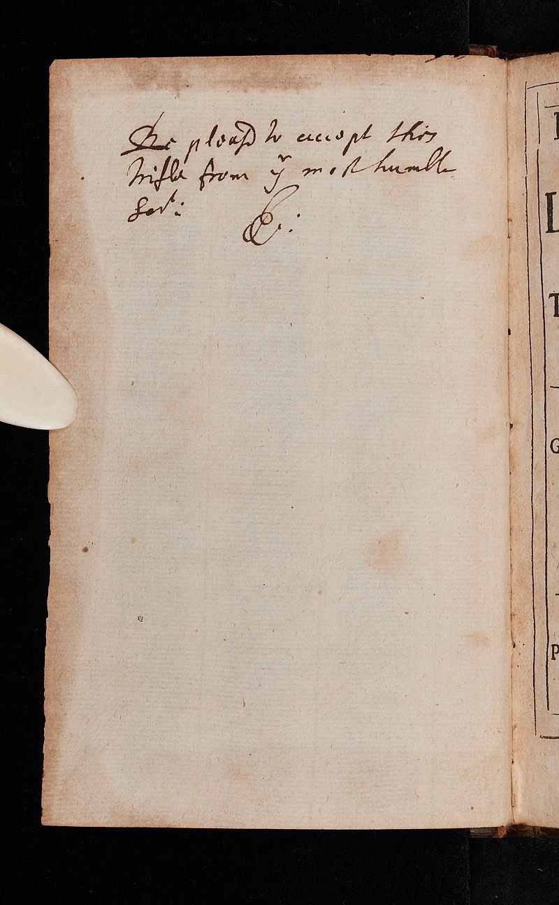 Inscription in ink opposite the title page of an old book.