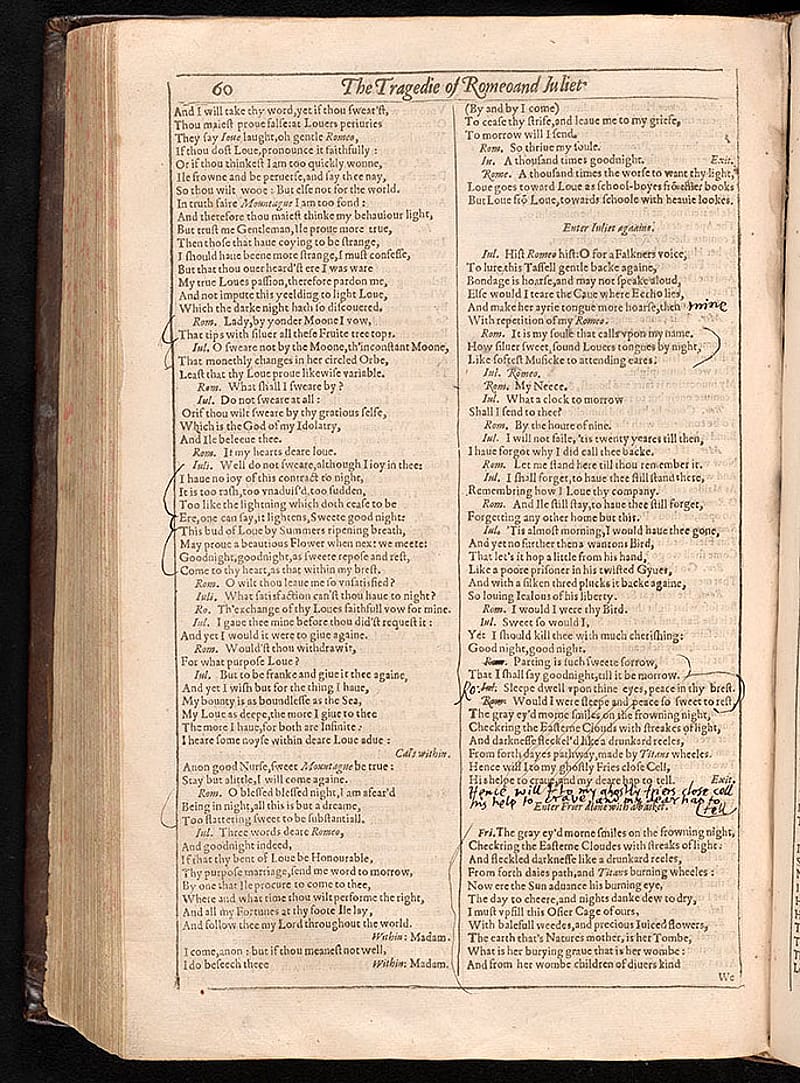 Page from an old book with printed text in a black border. There are some hand-written notes in black ink amongst the text.
